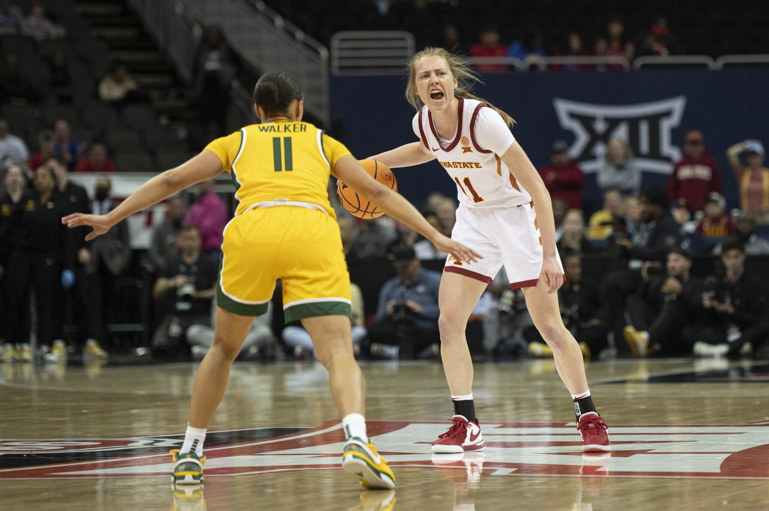 Iowa State guard Emily Ryan dribbles and calls out a play during the Big 12 quarterfinals.