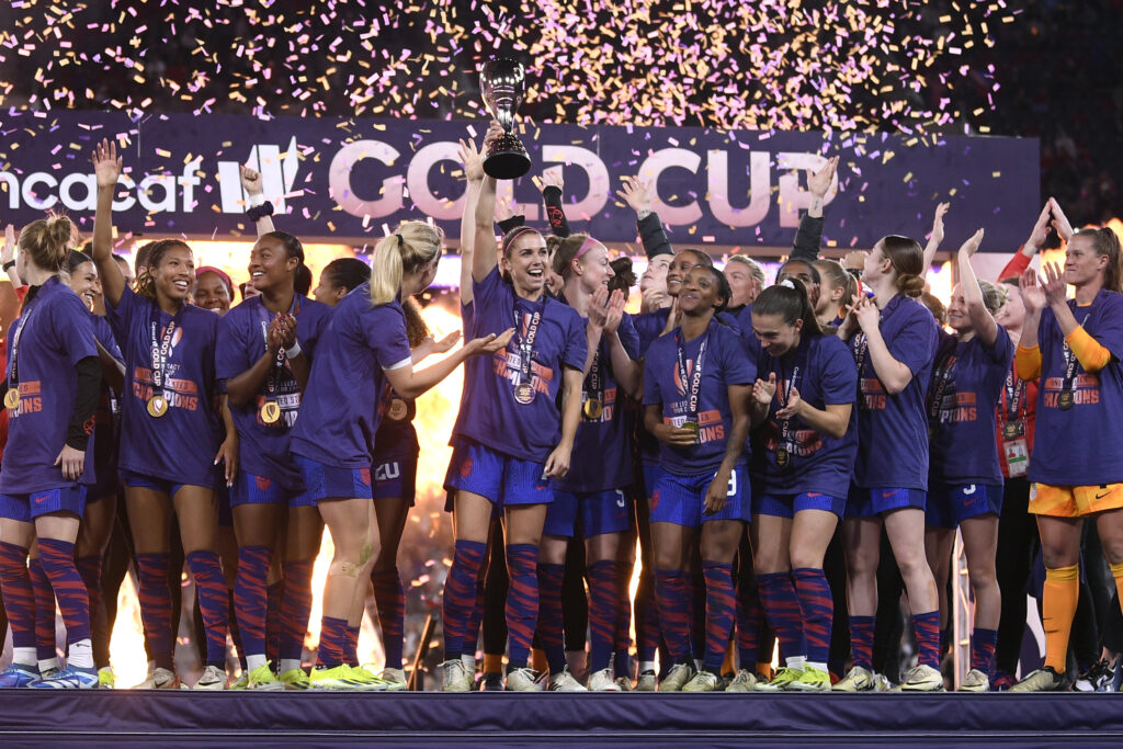 USWNT celebrates after winning the first ever Concacaf W Gold Cup