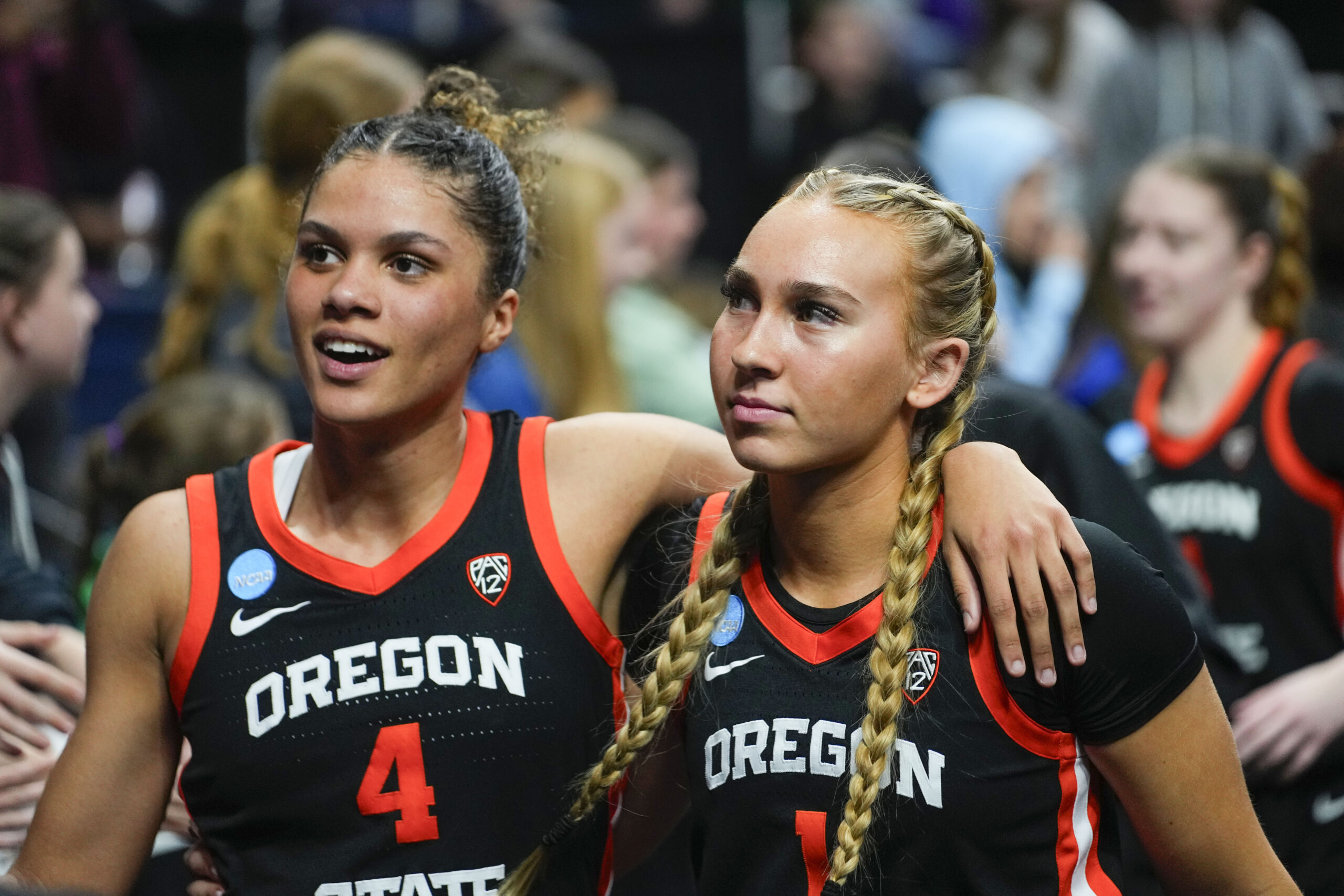 Oregon players walk off the court following a Sweet 16 victory