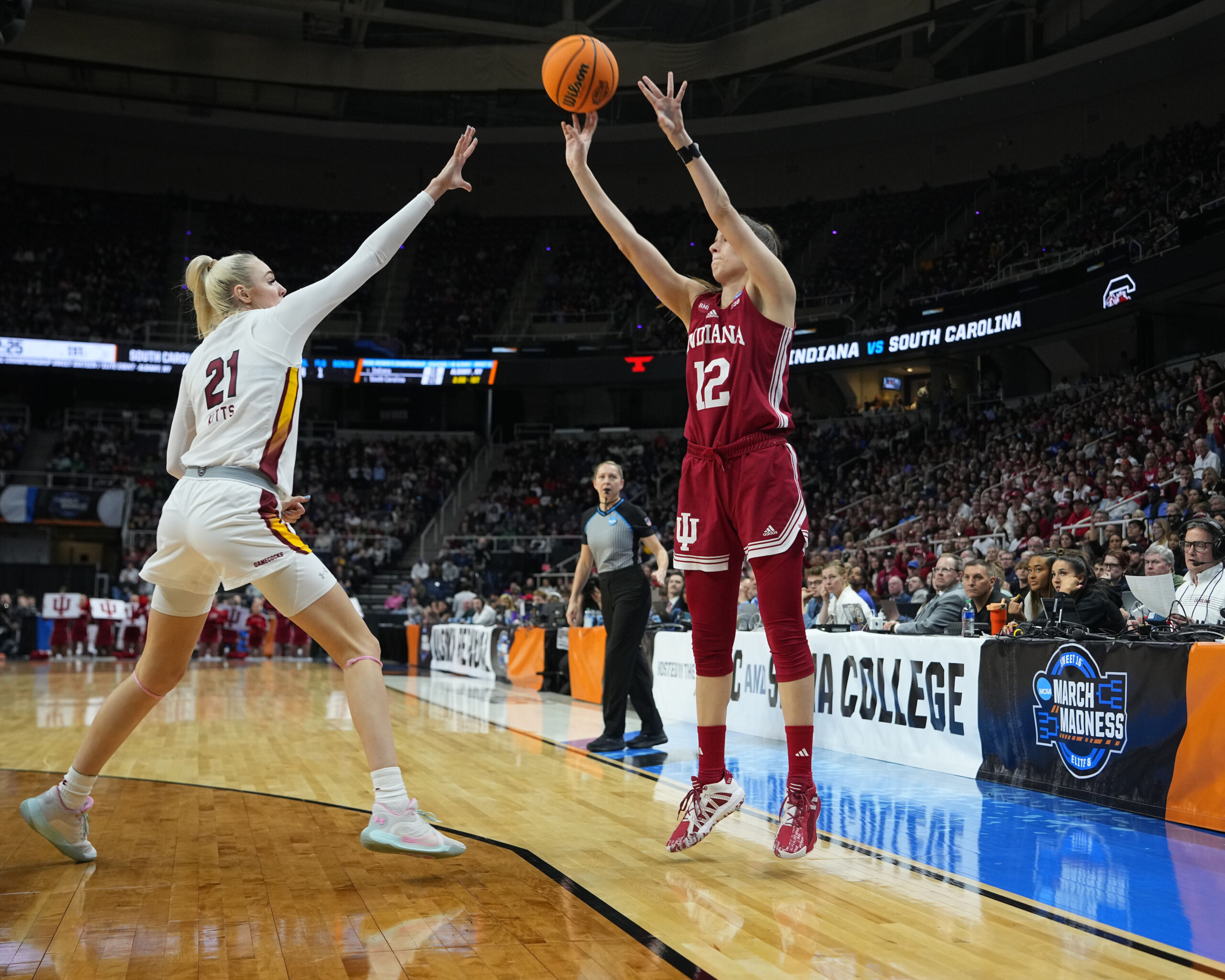 Indiana guard Yarden Garzon shoots a corner 3-pointer as a South Carolina defender puts a hand up to contest it.