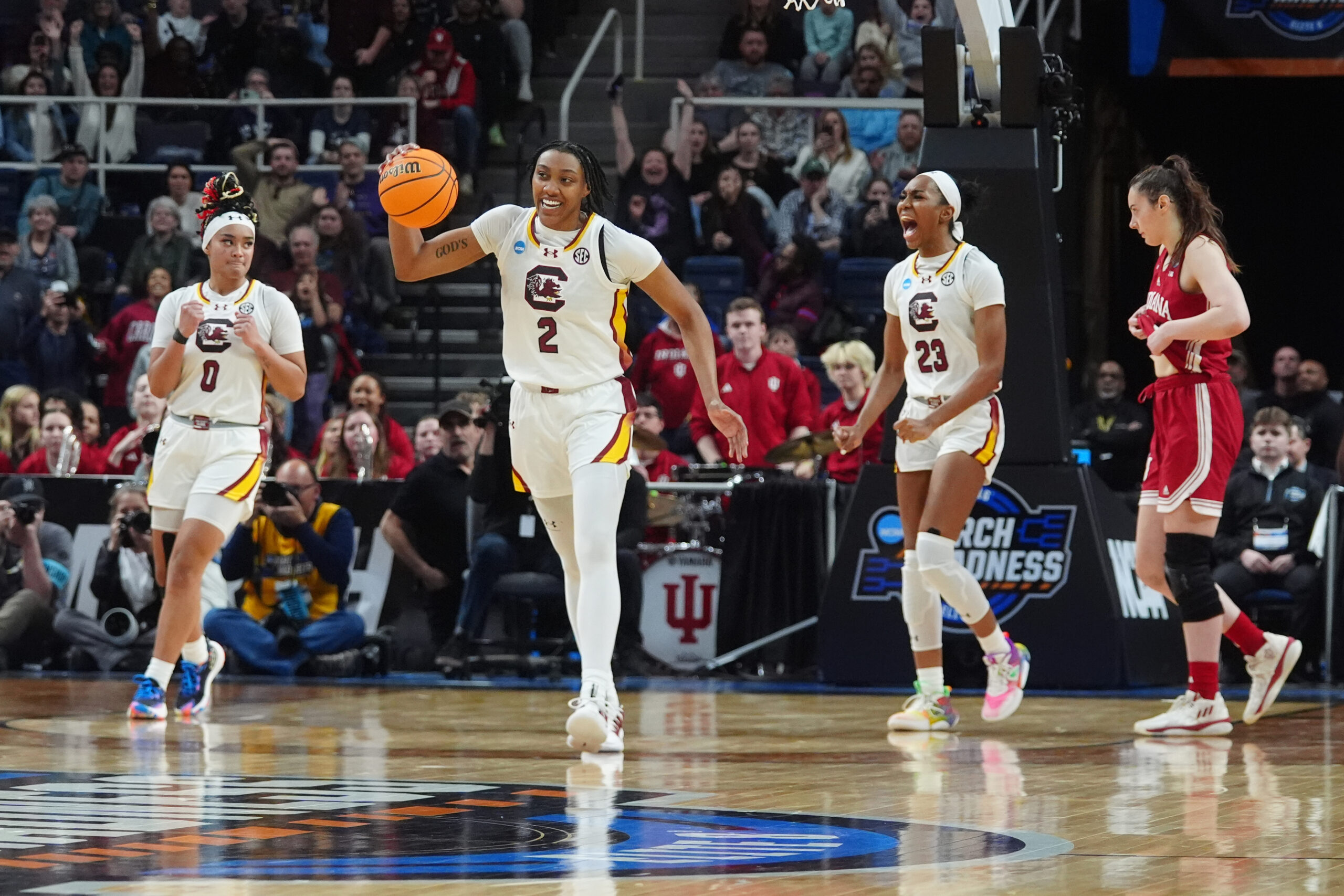 South Carolina forward Ashlyn Watkins dribbles out the clock with a smile on her face.