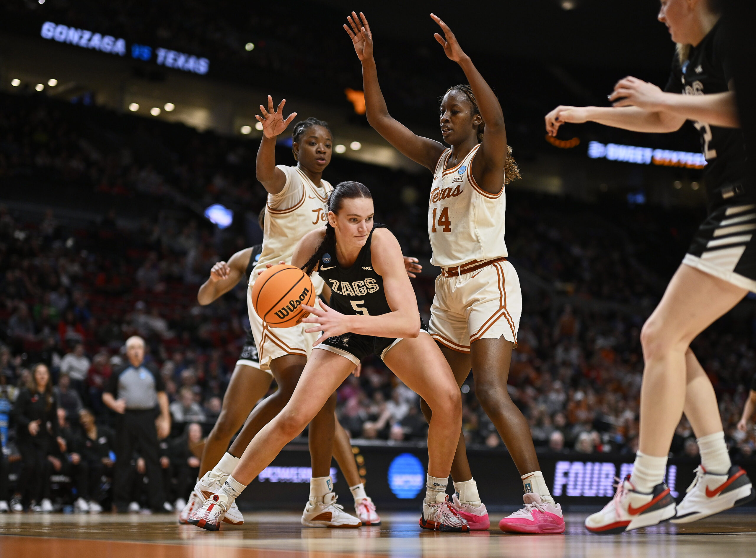 Gonzaga forward Maud Huijbens bends her knees and holds her position with the ball, looking for a way out of a Texas double team.