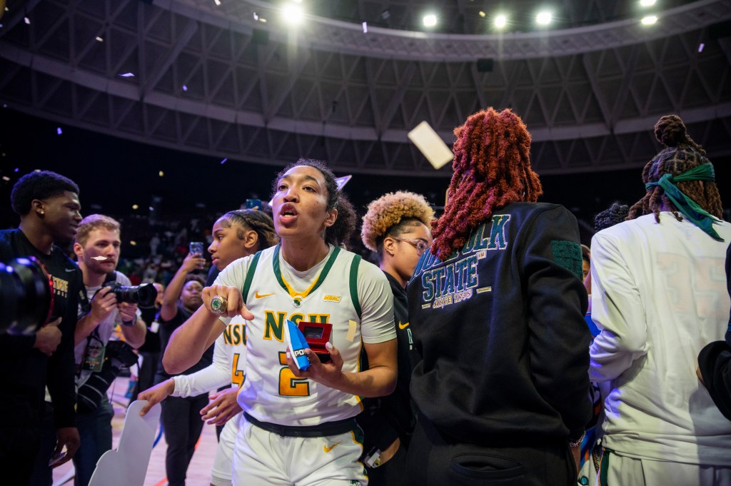 Norfolk State’s Niya Fields celebrates in a crowd on the court 
