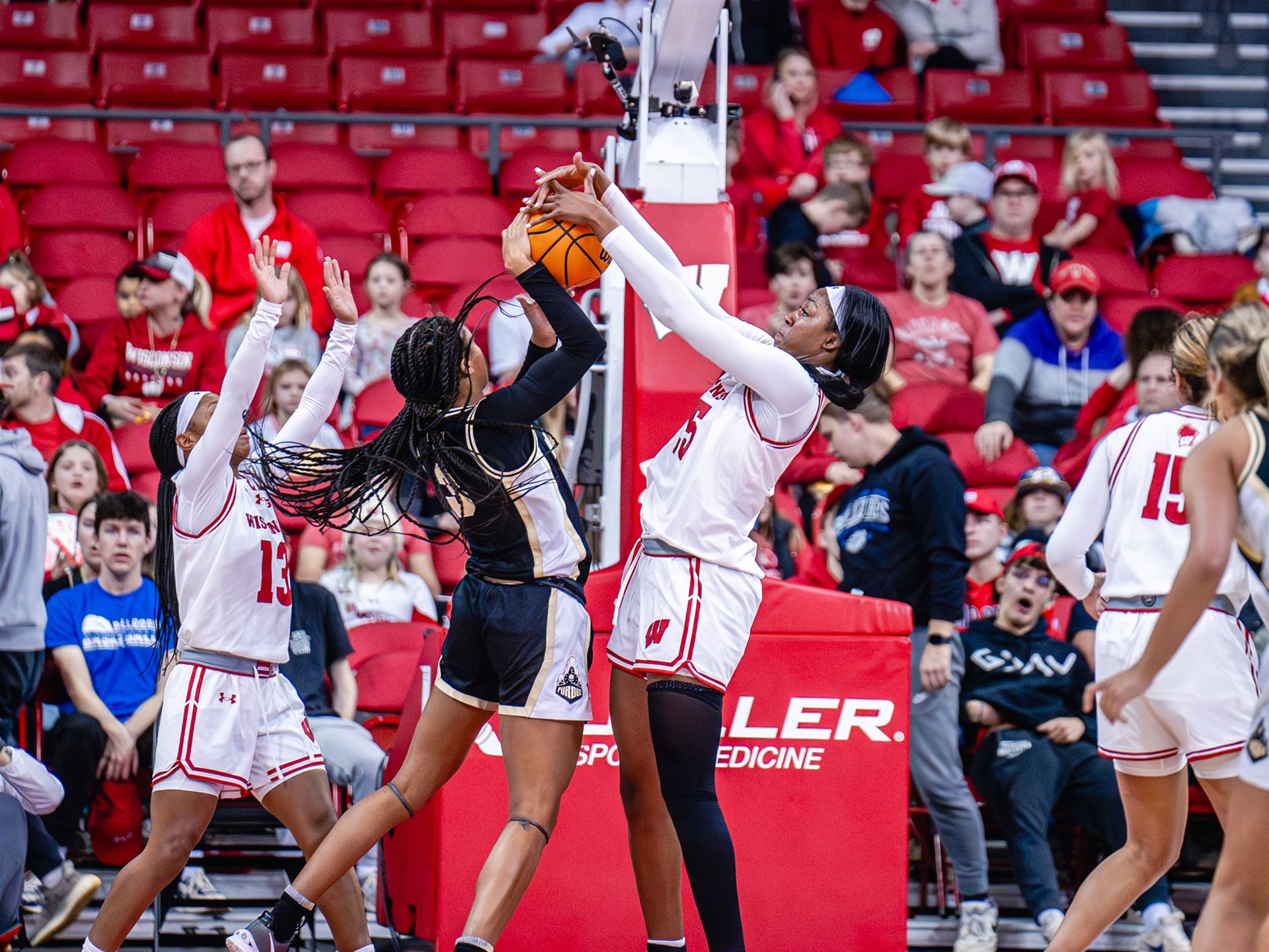 Wisconsin forward Serah Williams blocks a shot attempt from Purdue guard Jayla Smith with two hands.