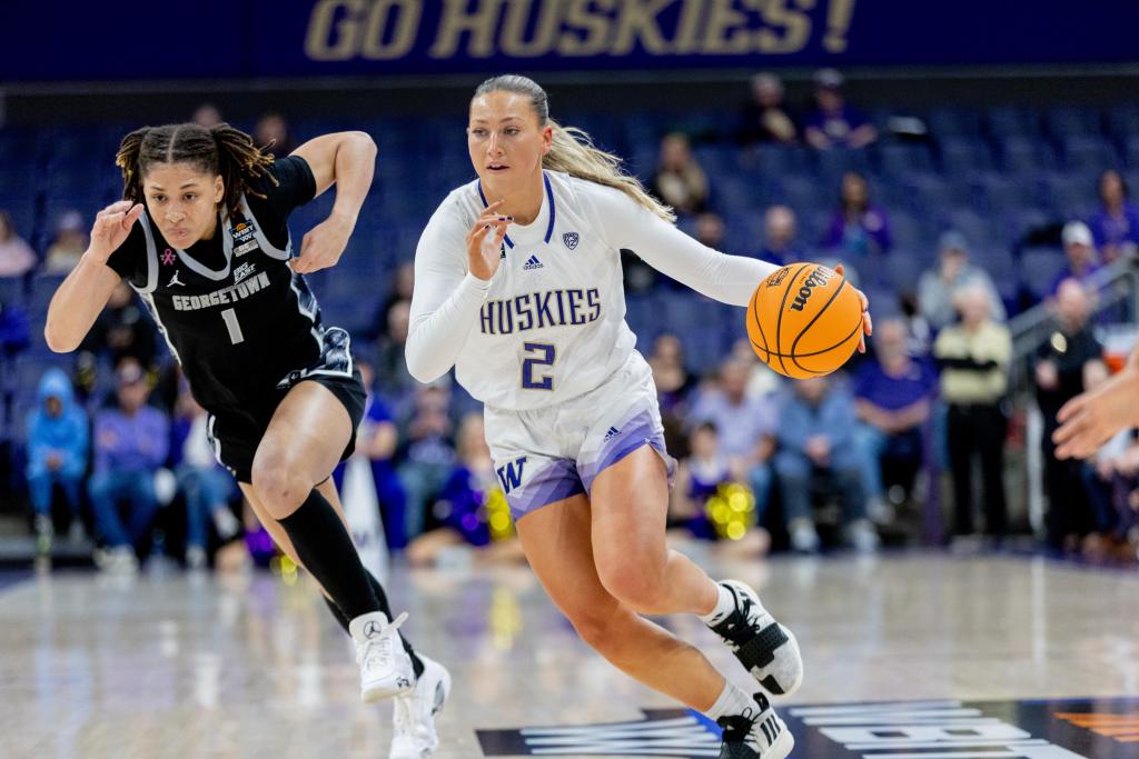Lauren Schwartz dribbles the basketball at speed while Kelsey Ransom chases back defensively.