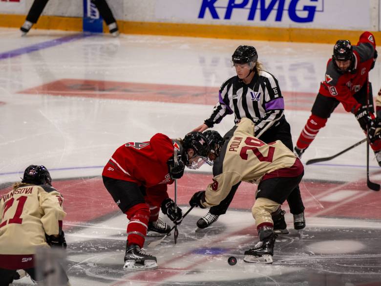 Ottawa and Montréal players face off at the start of a game.