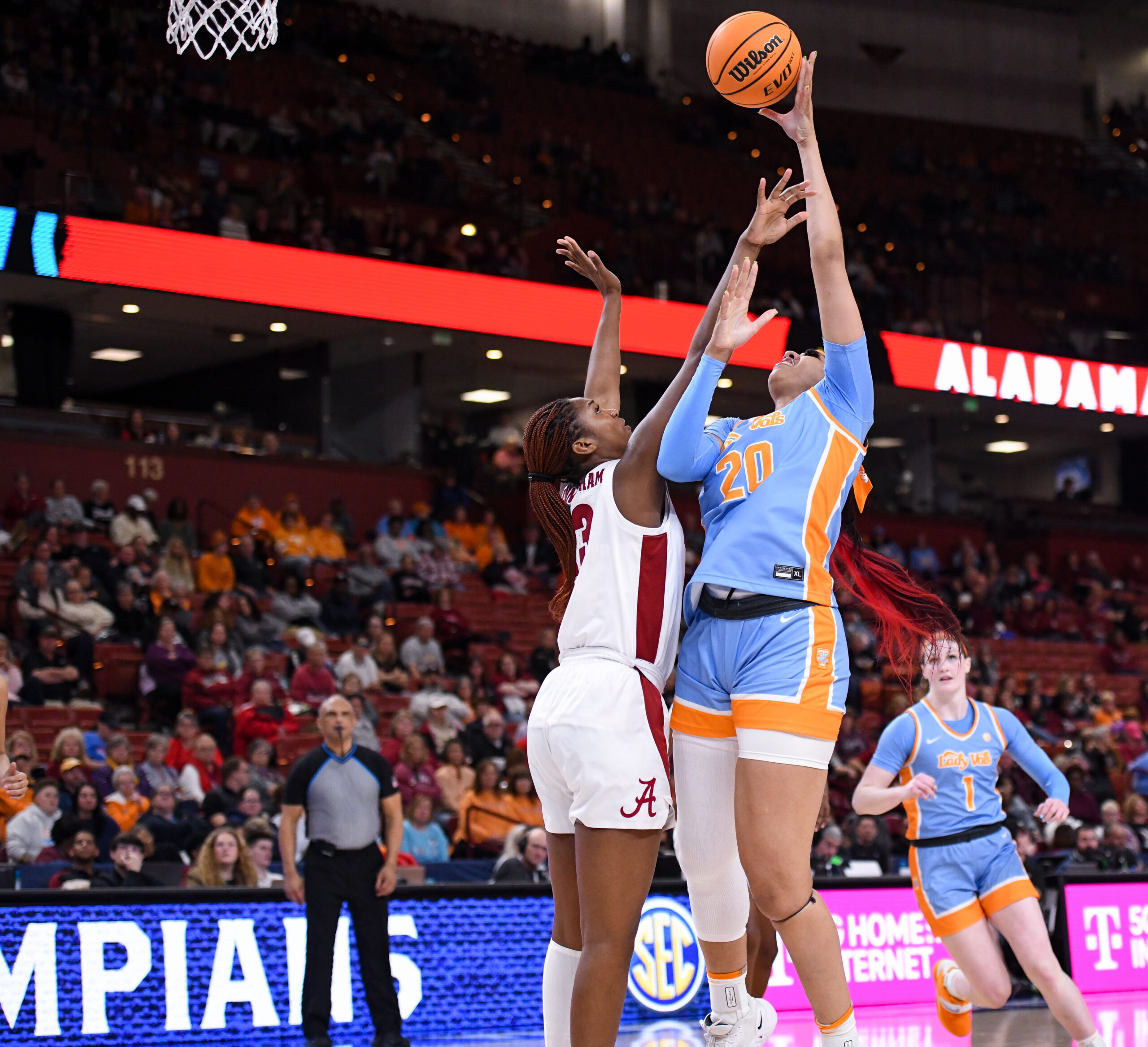 Tennessee center Tamari Key shoots a left-handed face-up shot over an Alabama defender's outstretched arms.