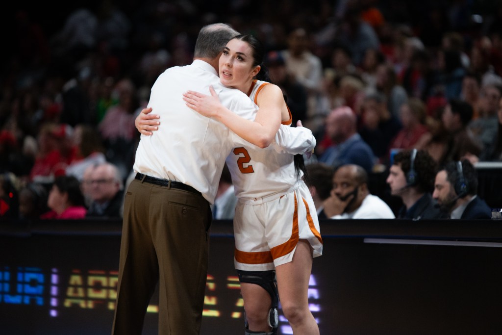 Texas guard Shaylee Gonzales embraces head coach