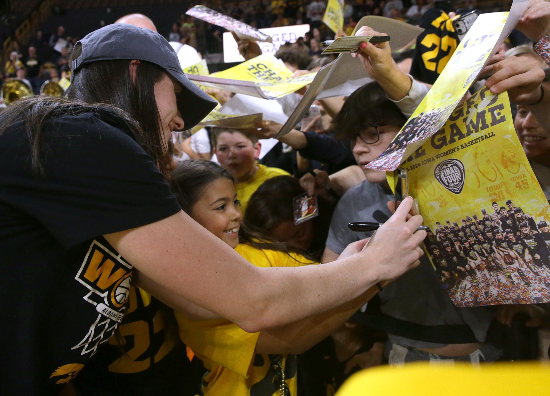 Caitlin Clark of Iowa signs autographs