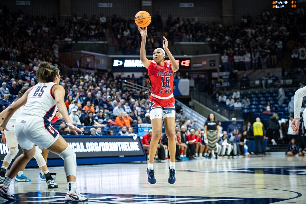 Jackson State center Angel Jackson shoots an open jump shot from near the top of the key.