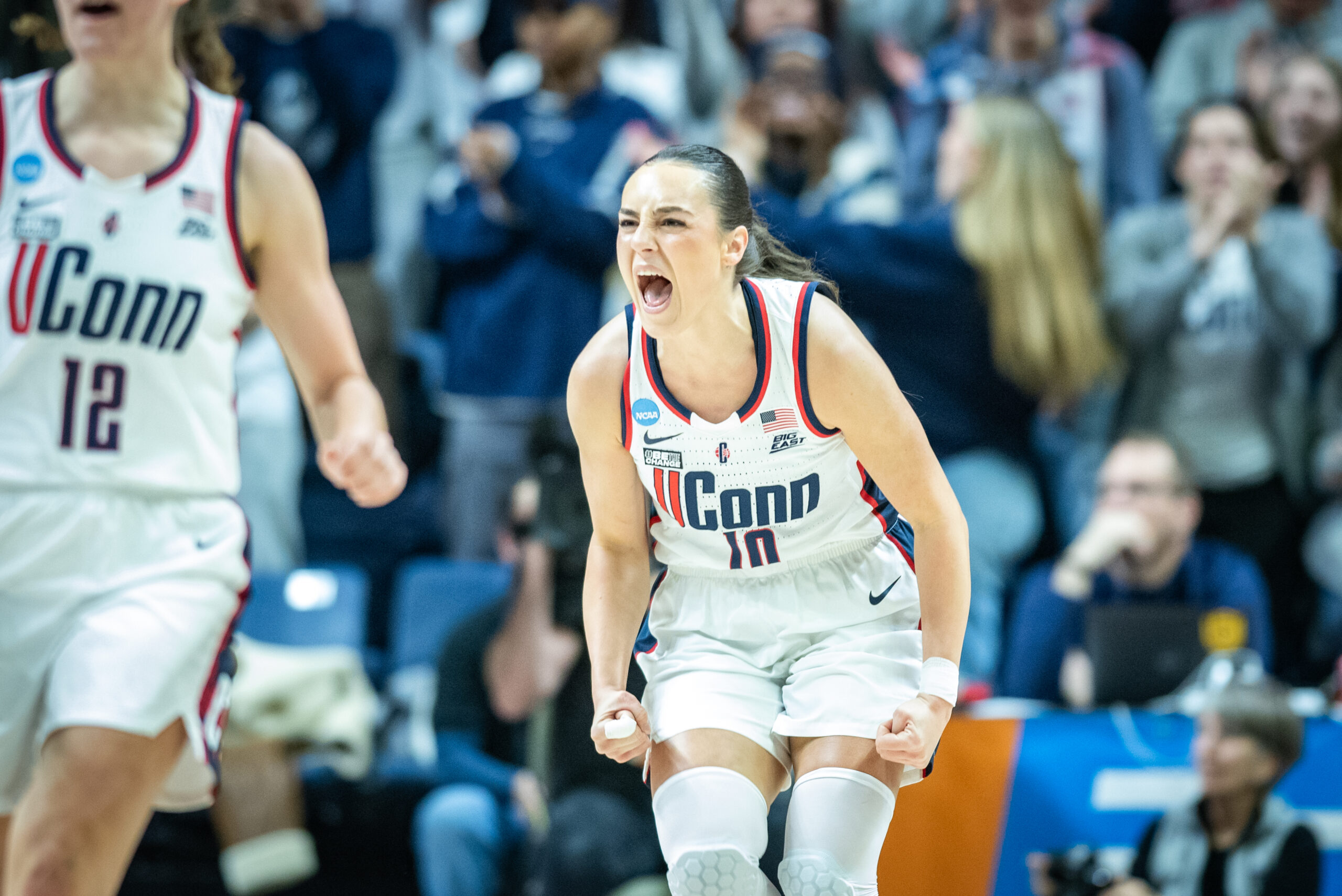 Nika Muhl screams and balls her fists in celebration of a play