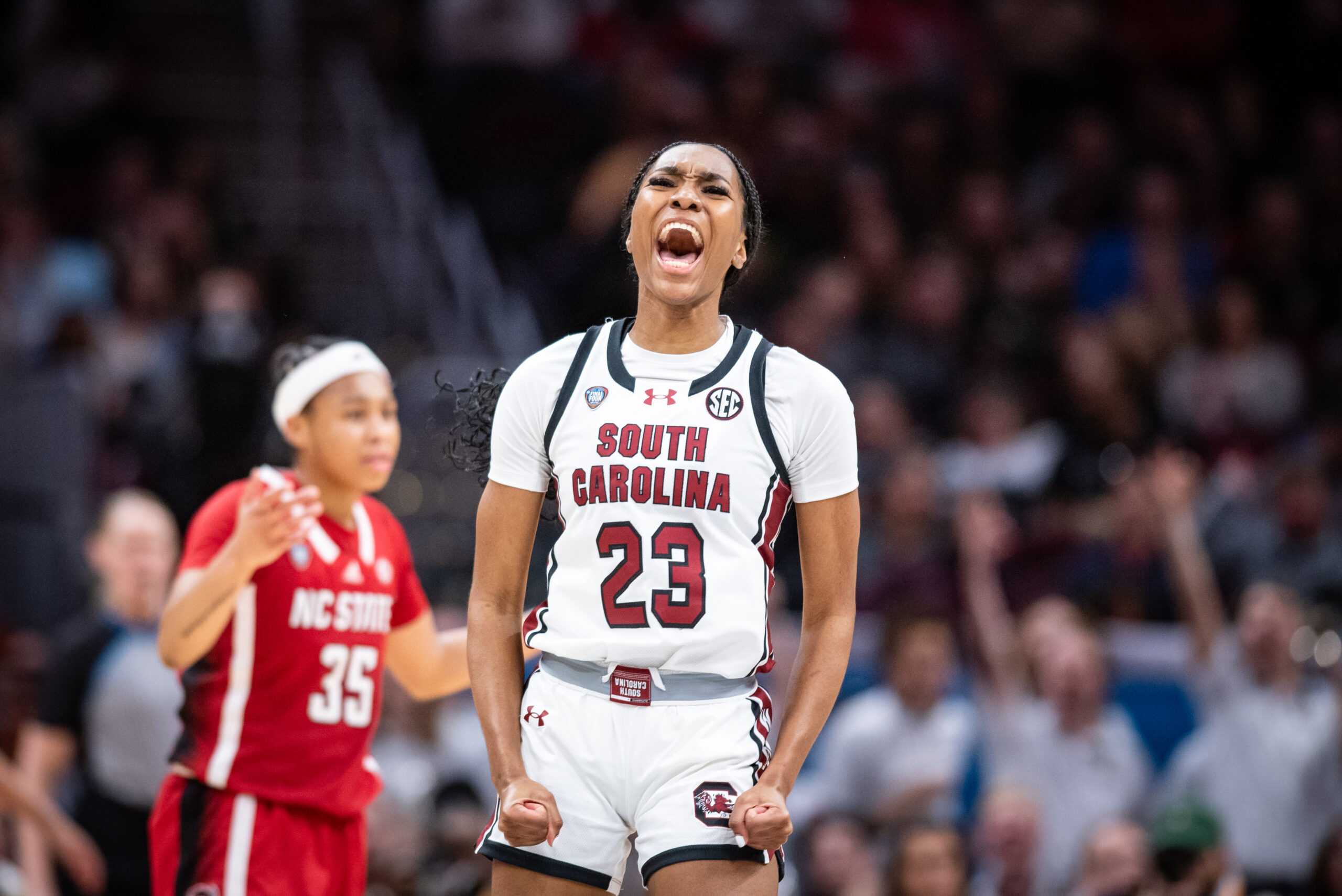 South Carolina guard Bree Hall yells and clenches her fists in celebration.
