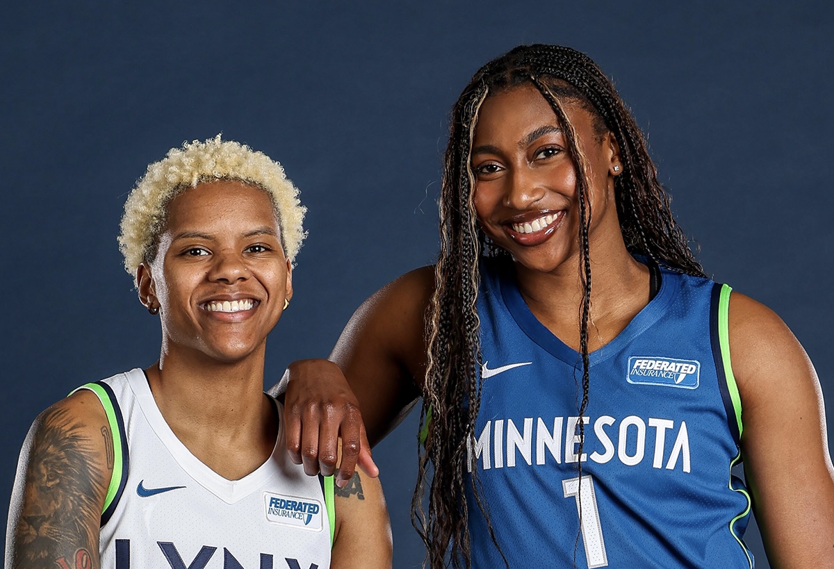Diamond Miller and Courtney Williams pose in their 2024 Minnesota Lynx jerseys. Miller's is blue and Williams' is white, and both have a new jersey patch for Federated Insurance visible near the left shoulder.