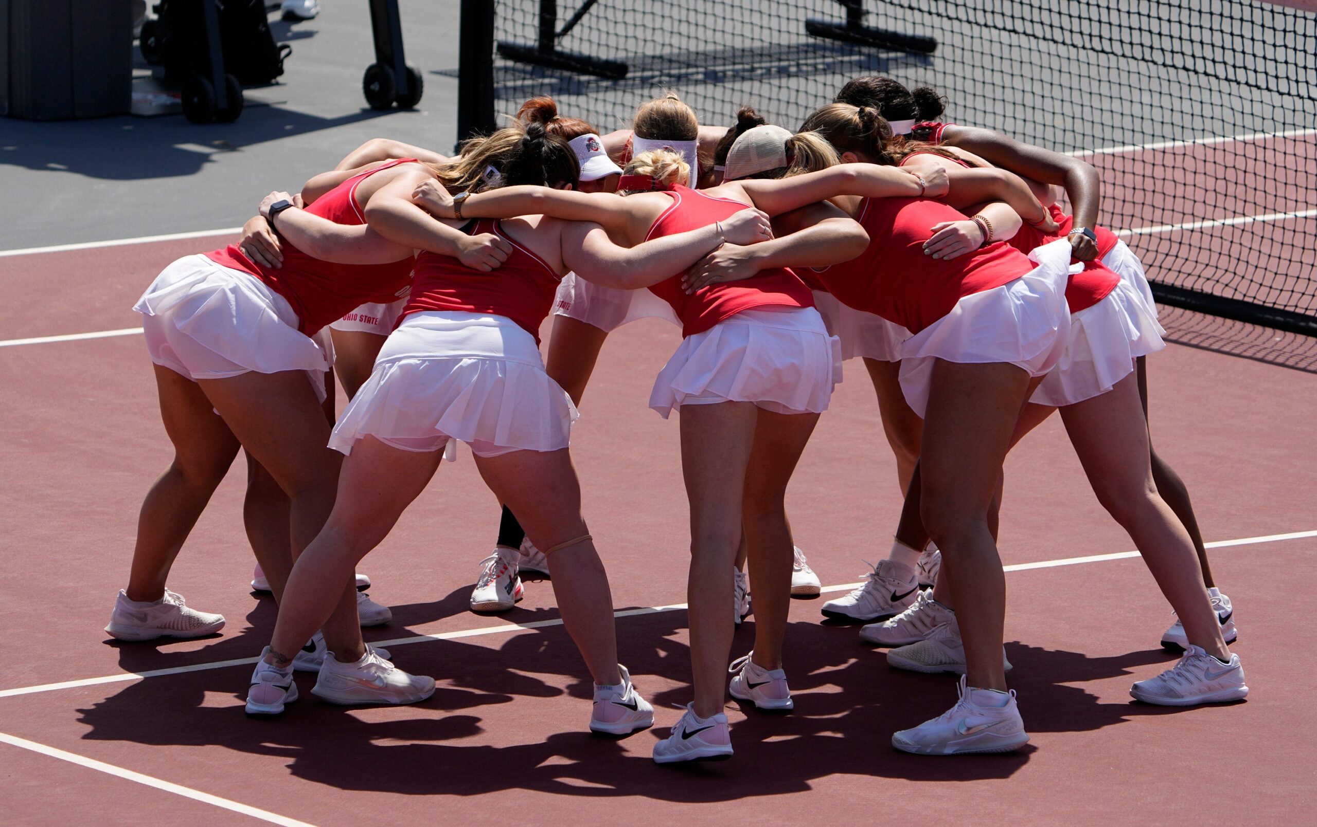 Ohio State's women's tennis team in a huddle