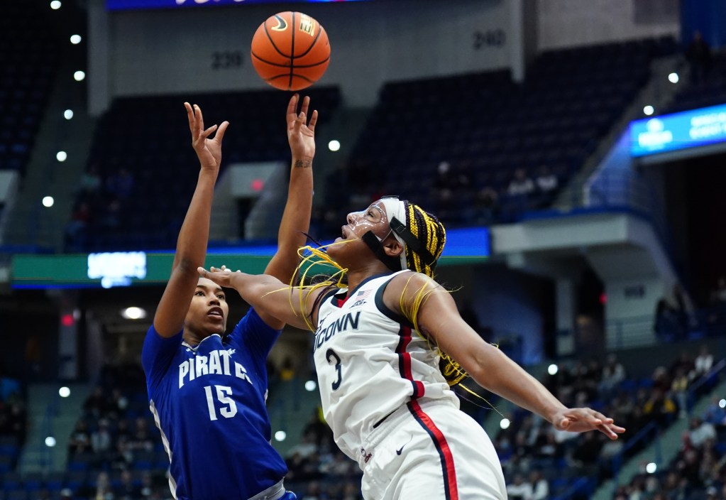 Azana Baines gets a shot up over Aaliyah Edwards