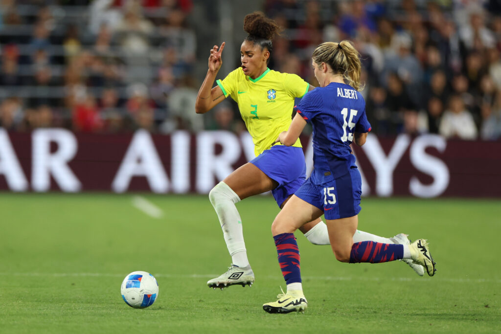 Korbin Albert battles with Brazil defender Tarciane