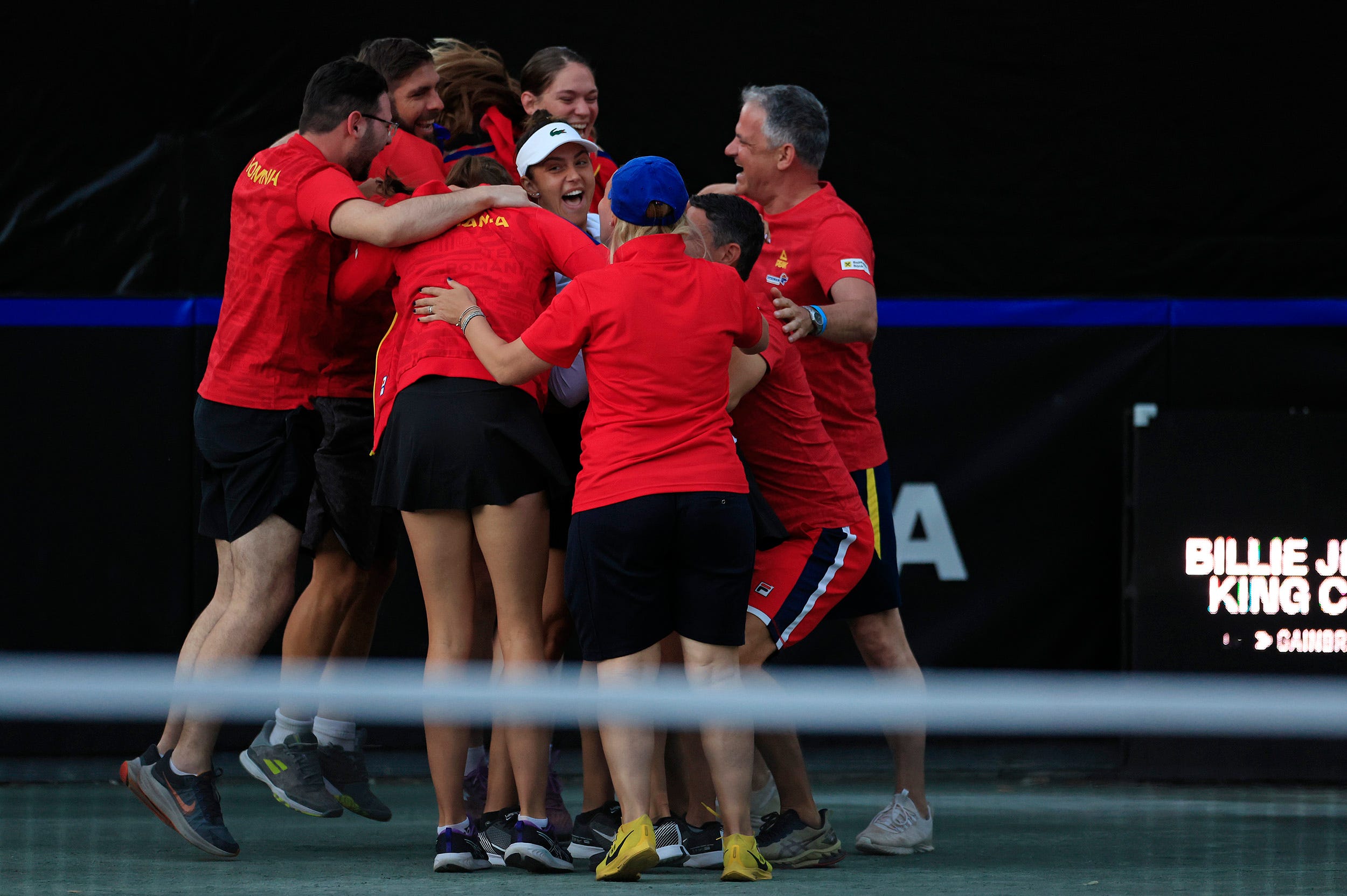 Team Romania celebrates in their Billie Jean King Cup qualifier