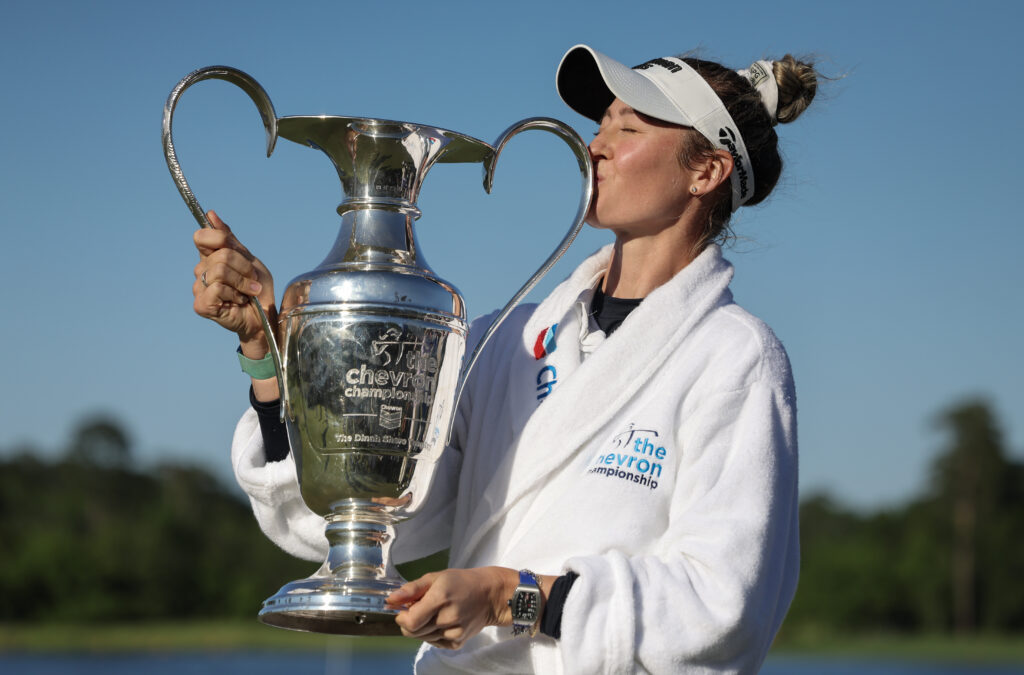 Nelly Korda kisses the Chevron Championship trophy