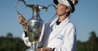 Nelly Korda kisses the Chevron Championship trophy
