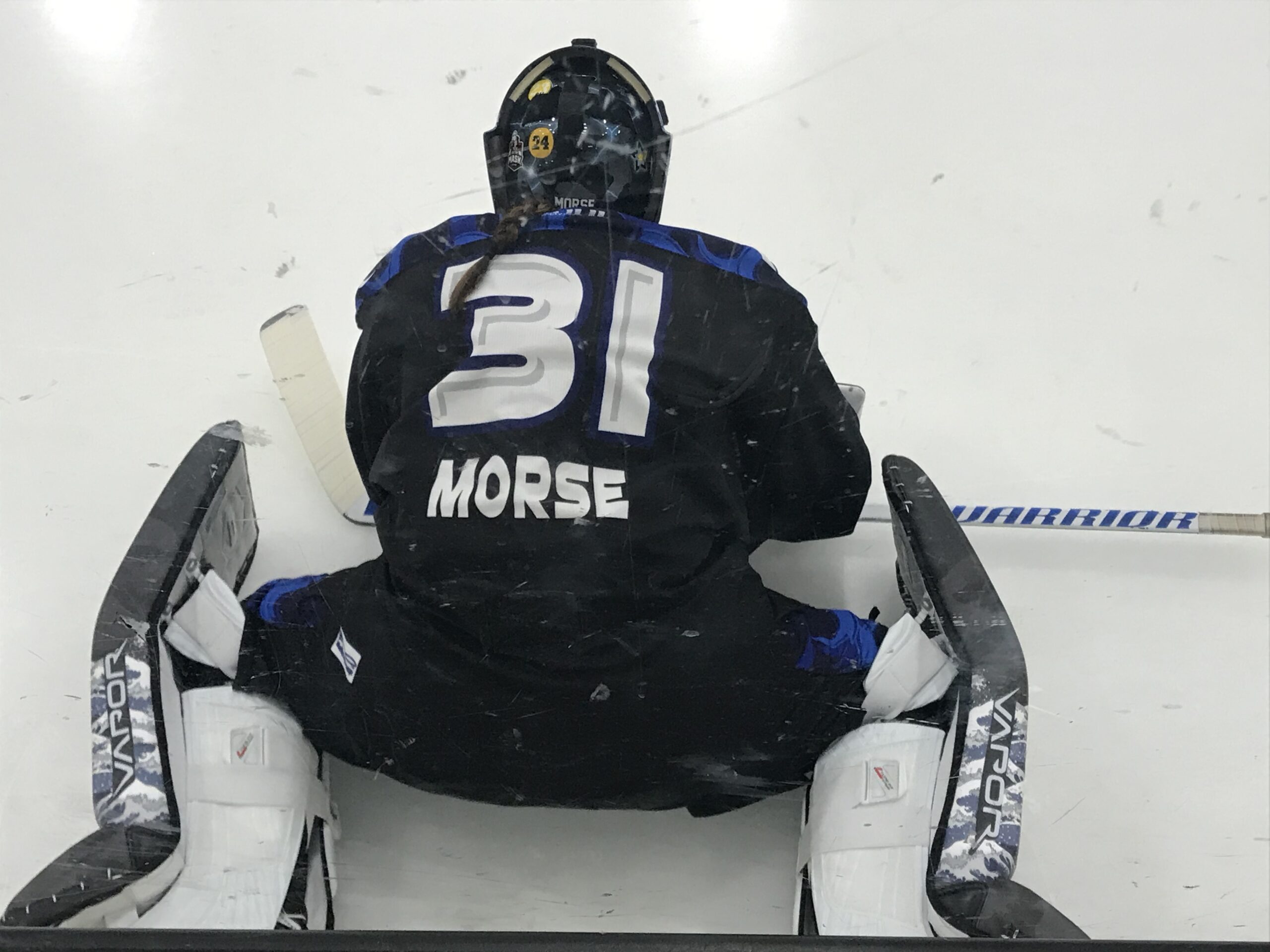 Goalie Allie Morse is pictured stretching on the ice