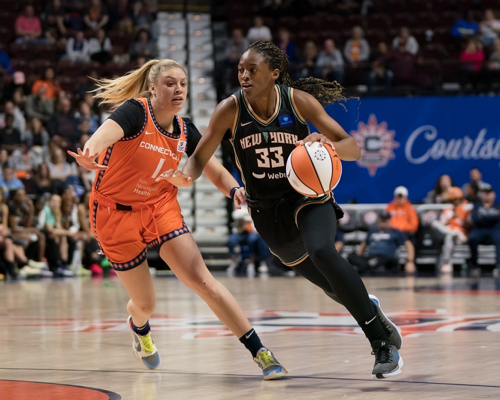 Stephanie Mawuli drives on Rachel Banham.