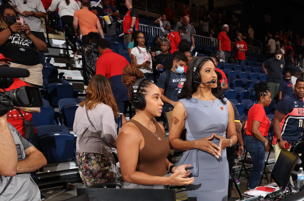 Meghan McPeak (left) and Christy Winters-Scott wrap up a game from their courtside broadcasting position. Photo credit: Monumental Sports & Entertainment