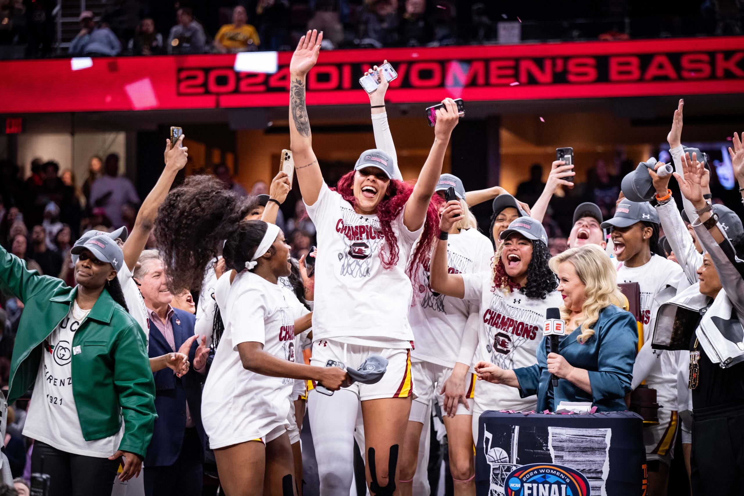Kamilla Cardoso raises her hands in celebration after her team won the NCAA national championship.