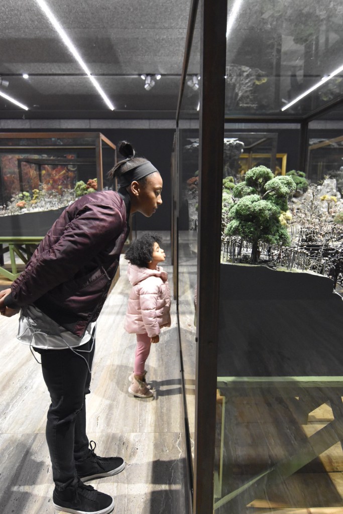 Jewell Loyd with Sloan Swann in Italy, looking at a museum exhibit