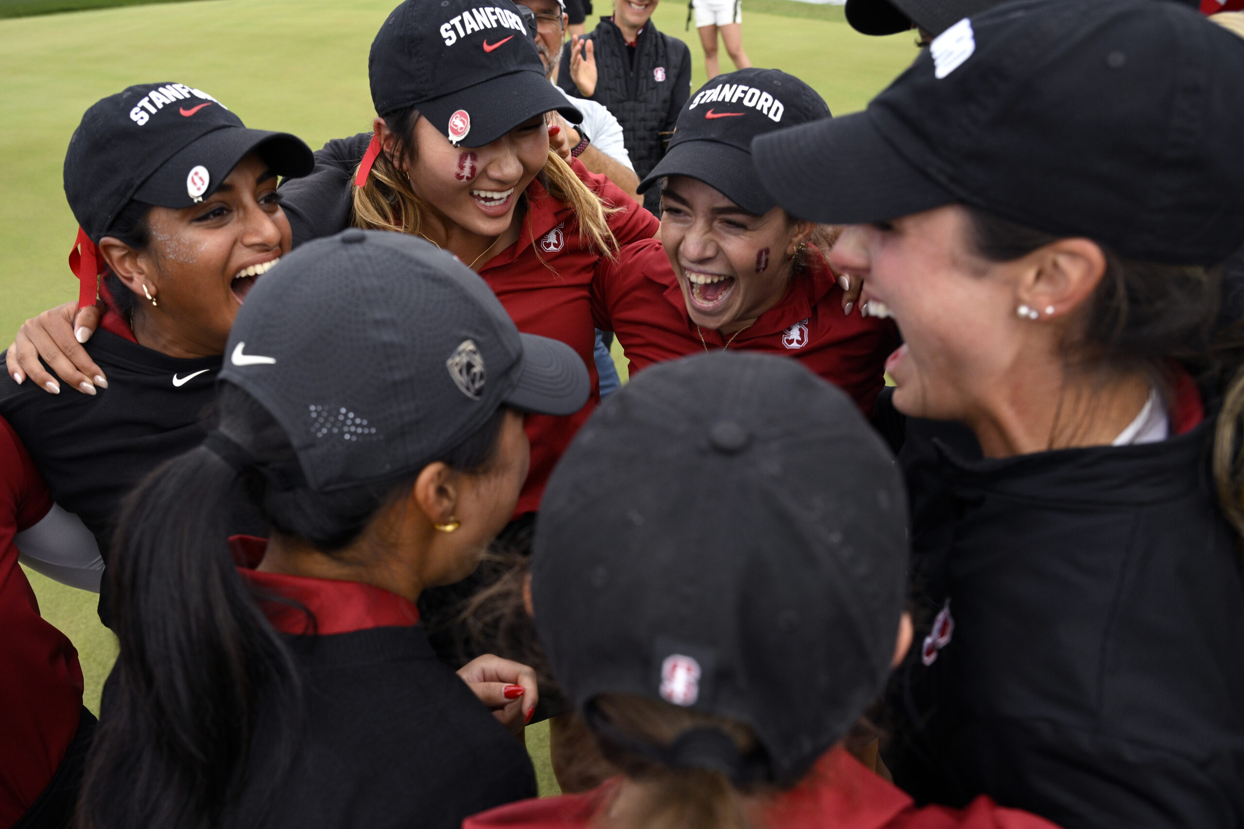 Stanford women's golf team and coaches celebrating after winning the 2024 NCAA Division I national championship.