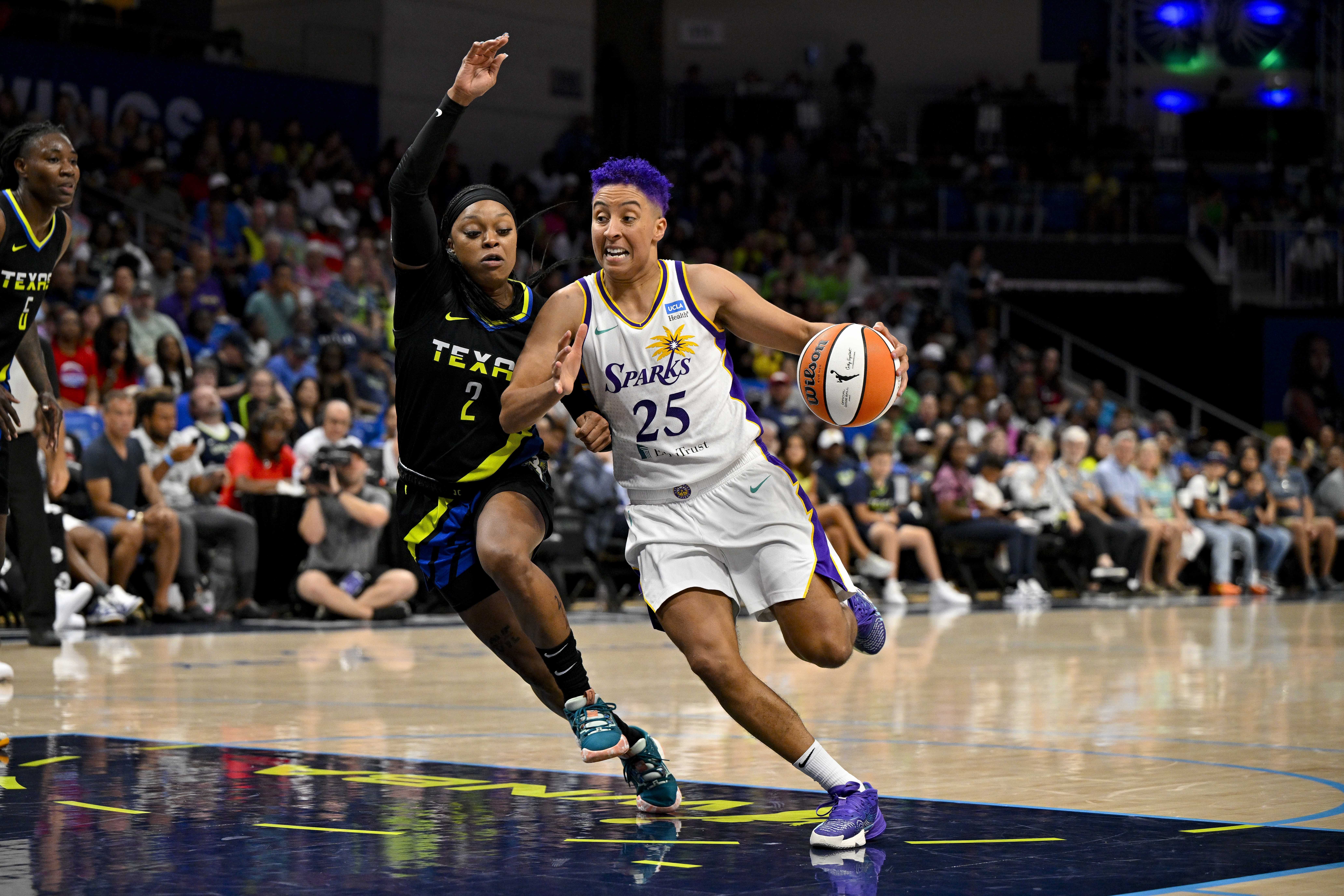 Sparks point guard Layshia Clarendon drives to the basket against the Dallas Wings.