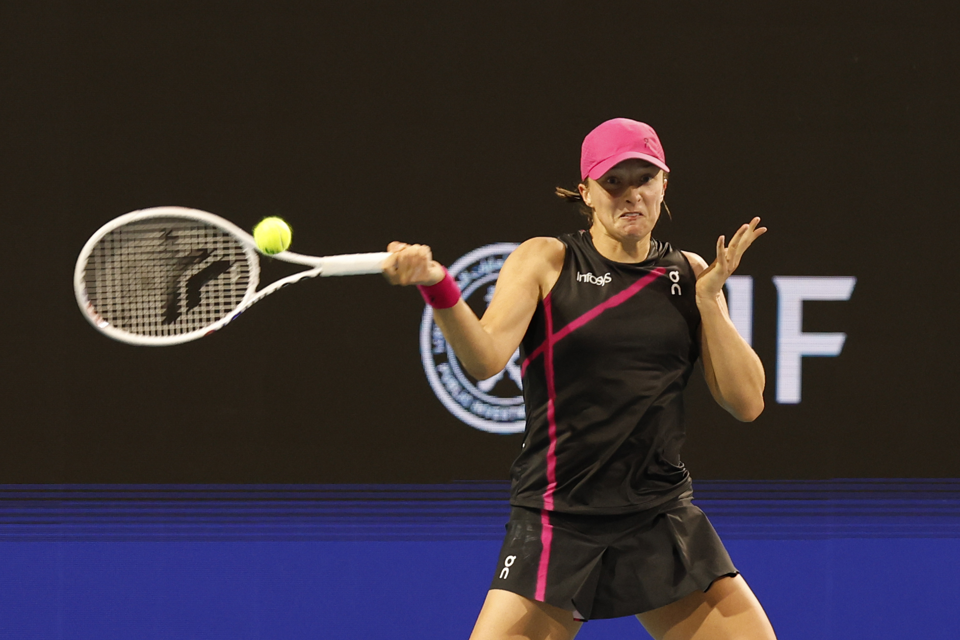 Iga Swiatek hitting a forehand