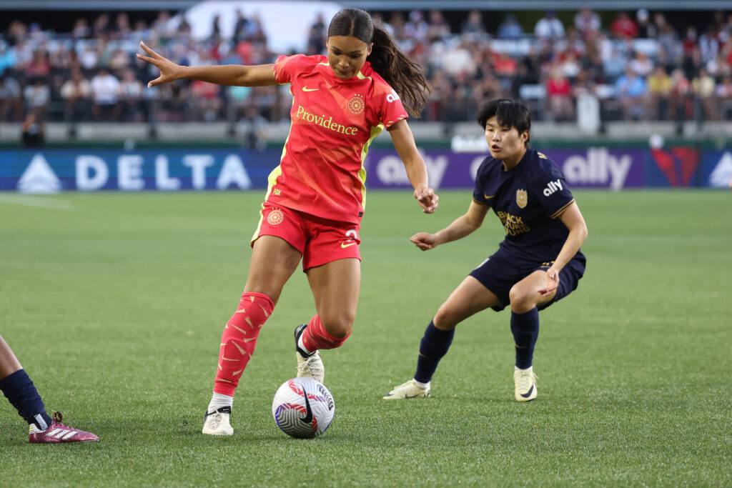 Sophia Smith on the ball during matchup against Seattle Reign