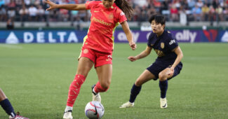 Sophia Smith on the ball during matchup against Seattle Reign