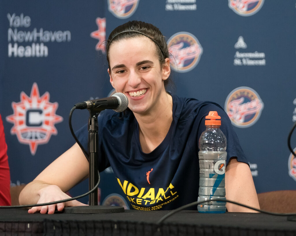 Caitlin Clark talks to the media.