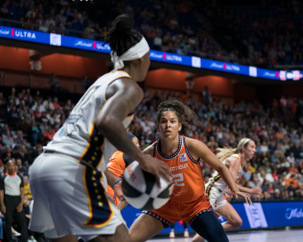 Veronica Burton in a defensive position guarding Fever guard Erica Wheeler