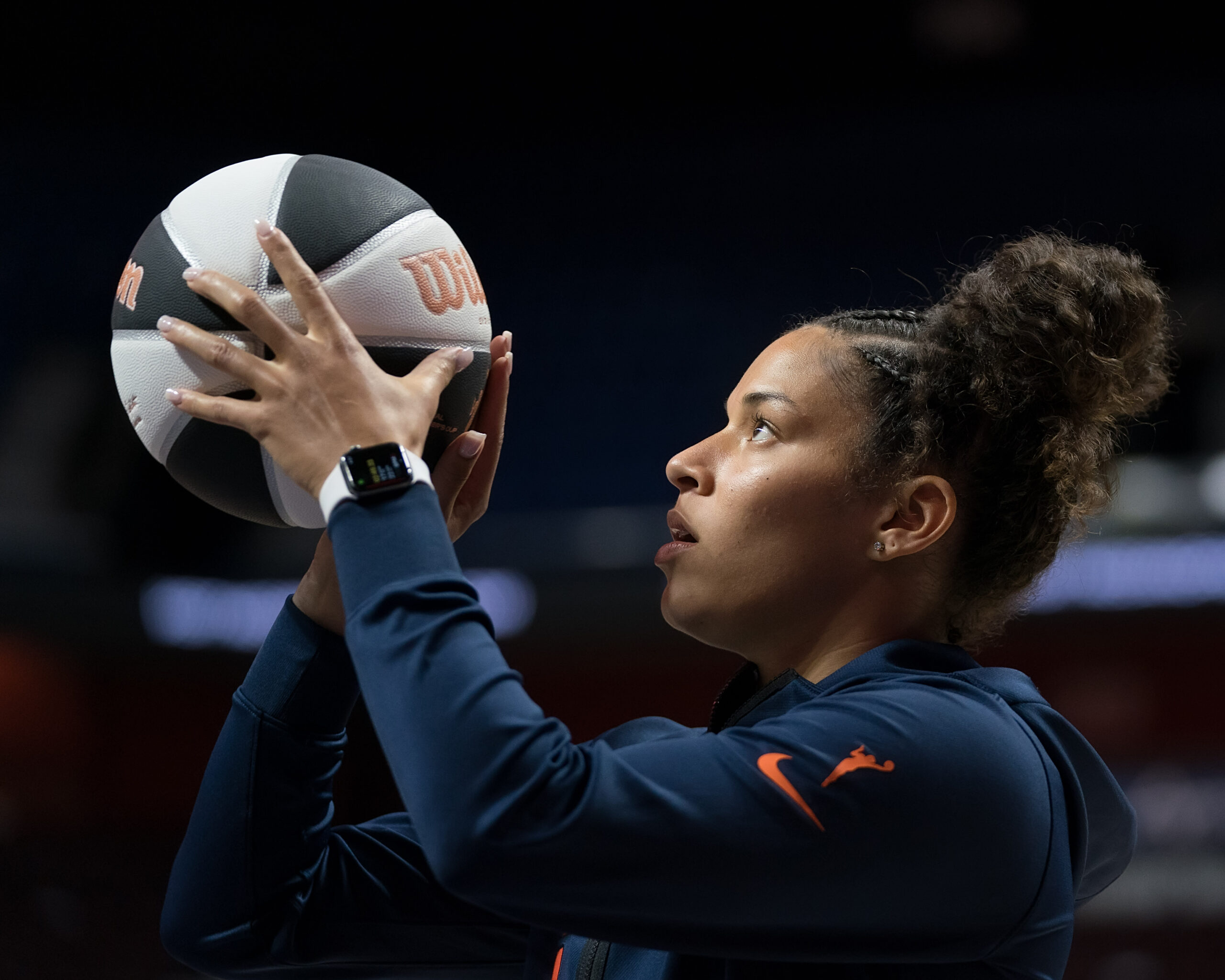 Connecticut Sun guard Veronica Burton warms up by shooting a basketball