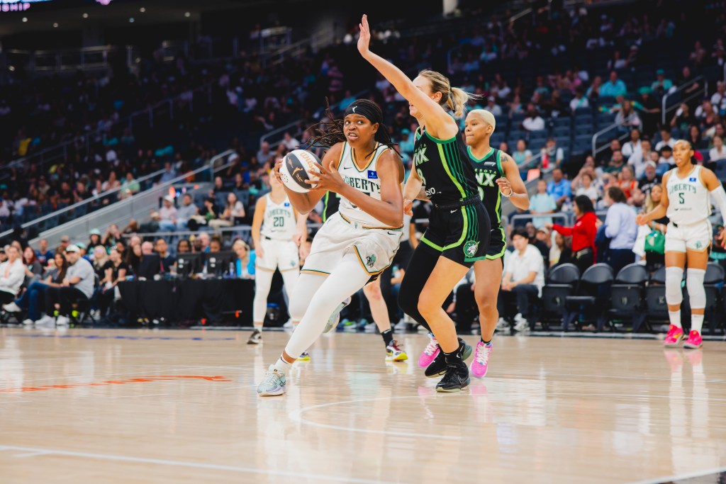 Jonquel Jones drives on <a rel=