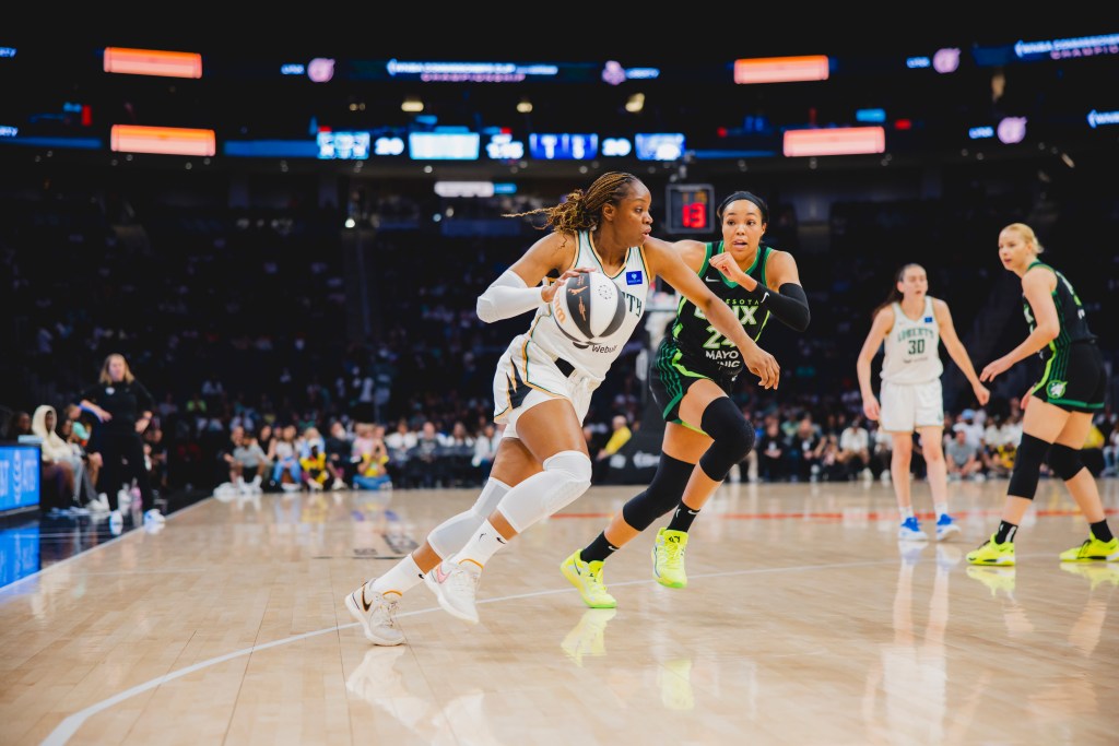 Kennedy Burke drives on Napheesa Collier