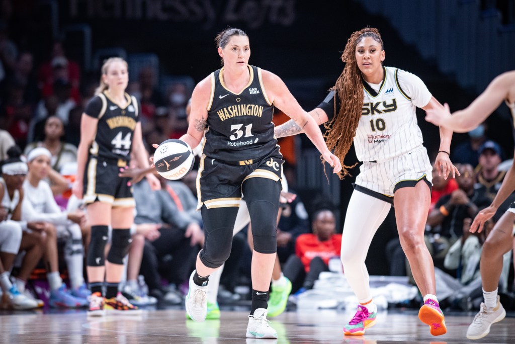 Chicago Sky center extends her arm to guard Washington Mystics center <a rel=