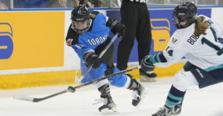 Toronto forward Brittany Howard handles the puck
