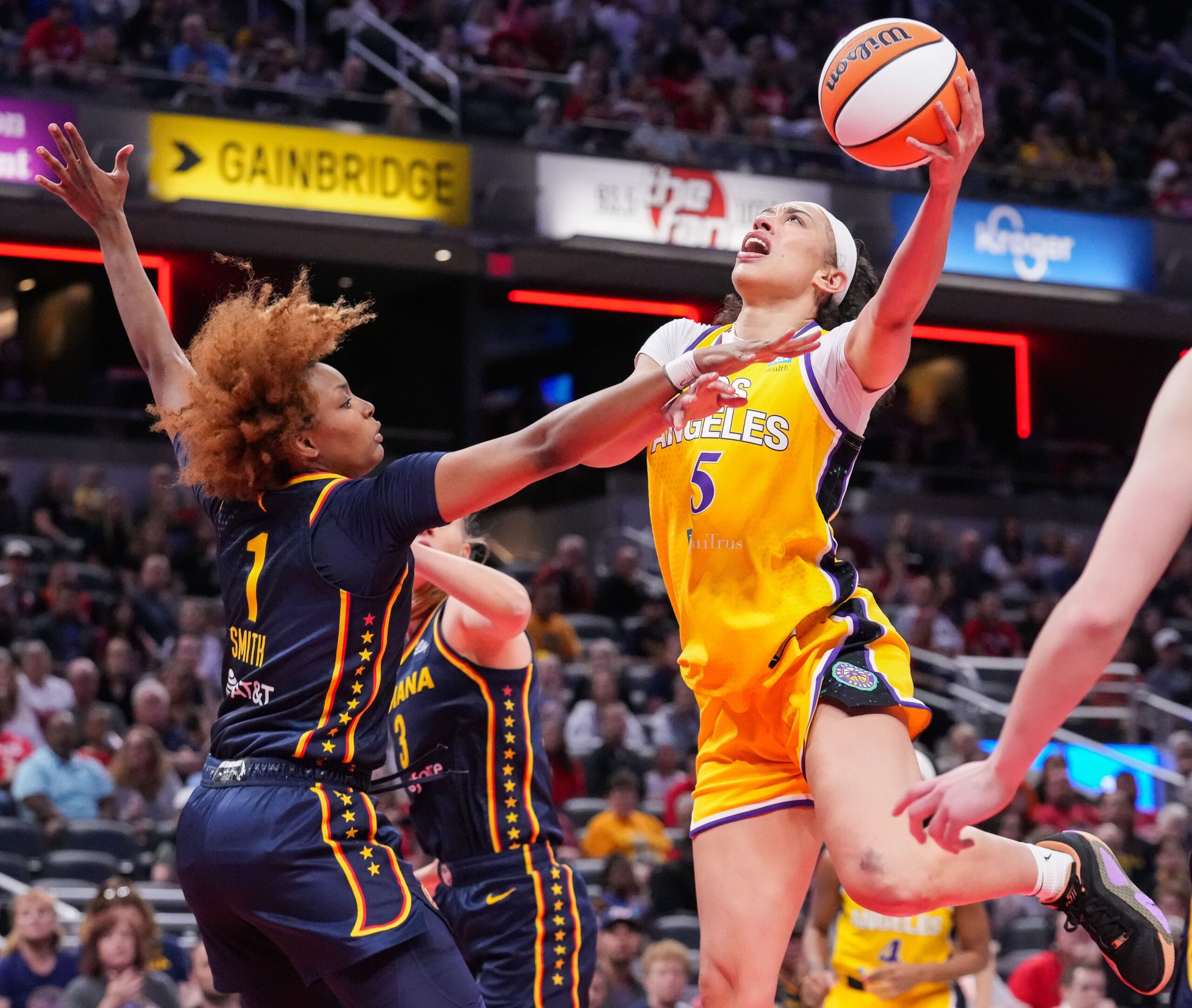 Dearica Hamby shoots a layup over Nalyssa Smith in a game between the Los Angeles Sparks and Indiana Fever.