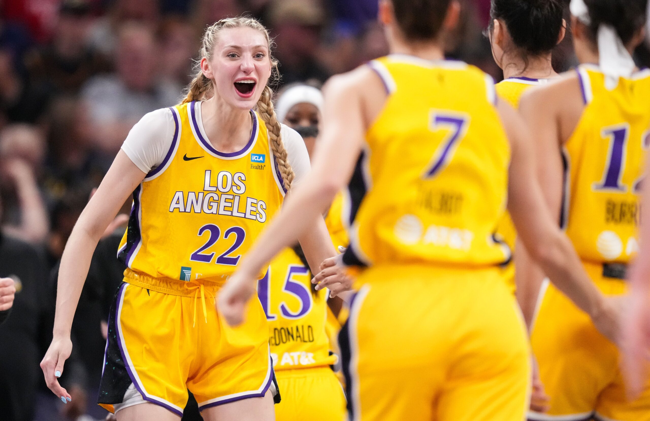 Los Angeles Sparks forward Cameron Brink celebrates with teammate Kia Nurse during a victory over the Indiana Fever.