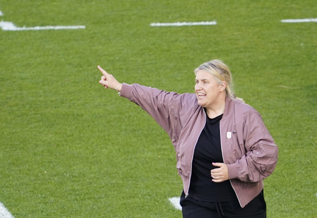 USWNT head coach calls out directions from the sideline
