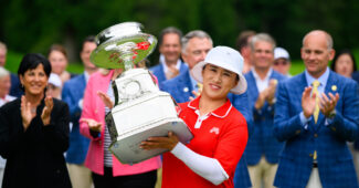 Amy Yang holding the trophy after winning the 2024 KPMG Women's PGA Championship.
