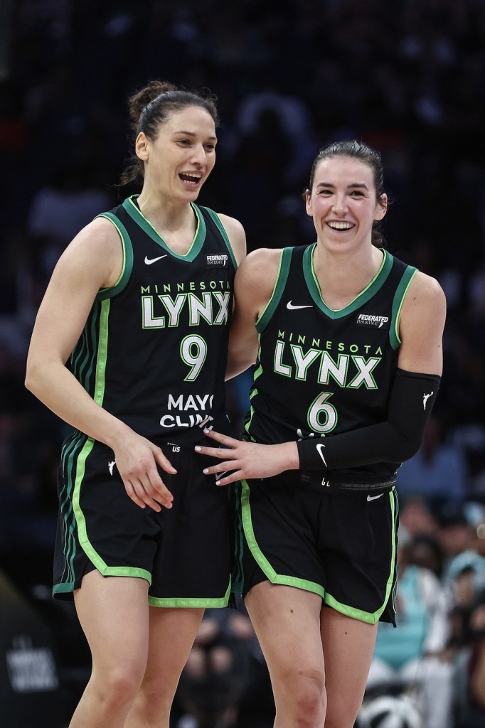 Lynx players Ceci Zandalasini and Bridget Carleton celebrate and smile together
