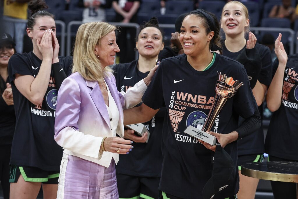 The Minnesota Lynx celebrate with Commissioner Cathy Engelbert.