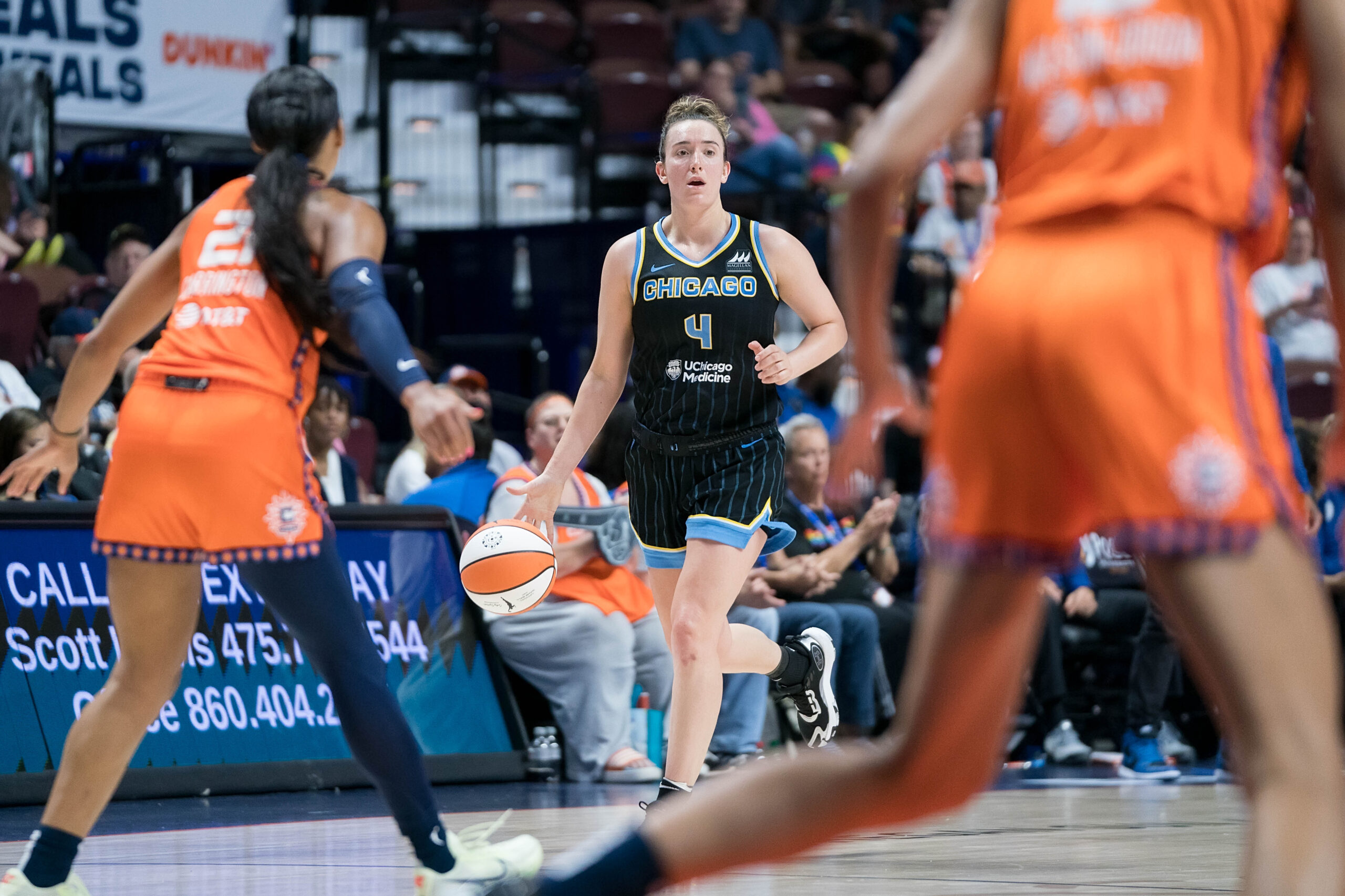 Marina Mabrey dribbles the basketball