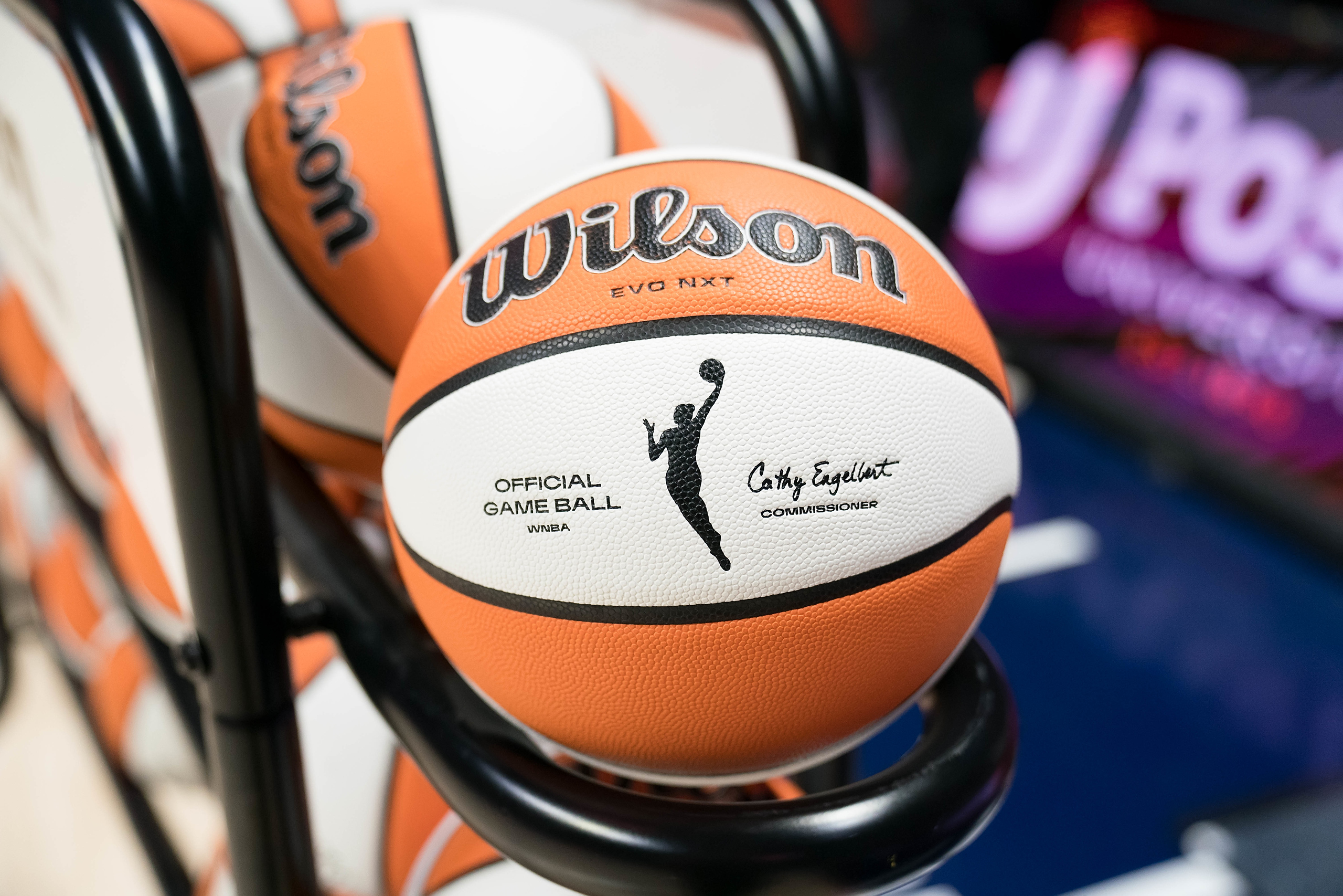 A photo of an orange and white basketball