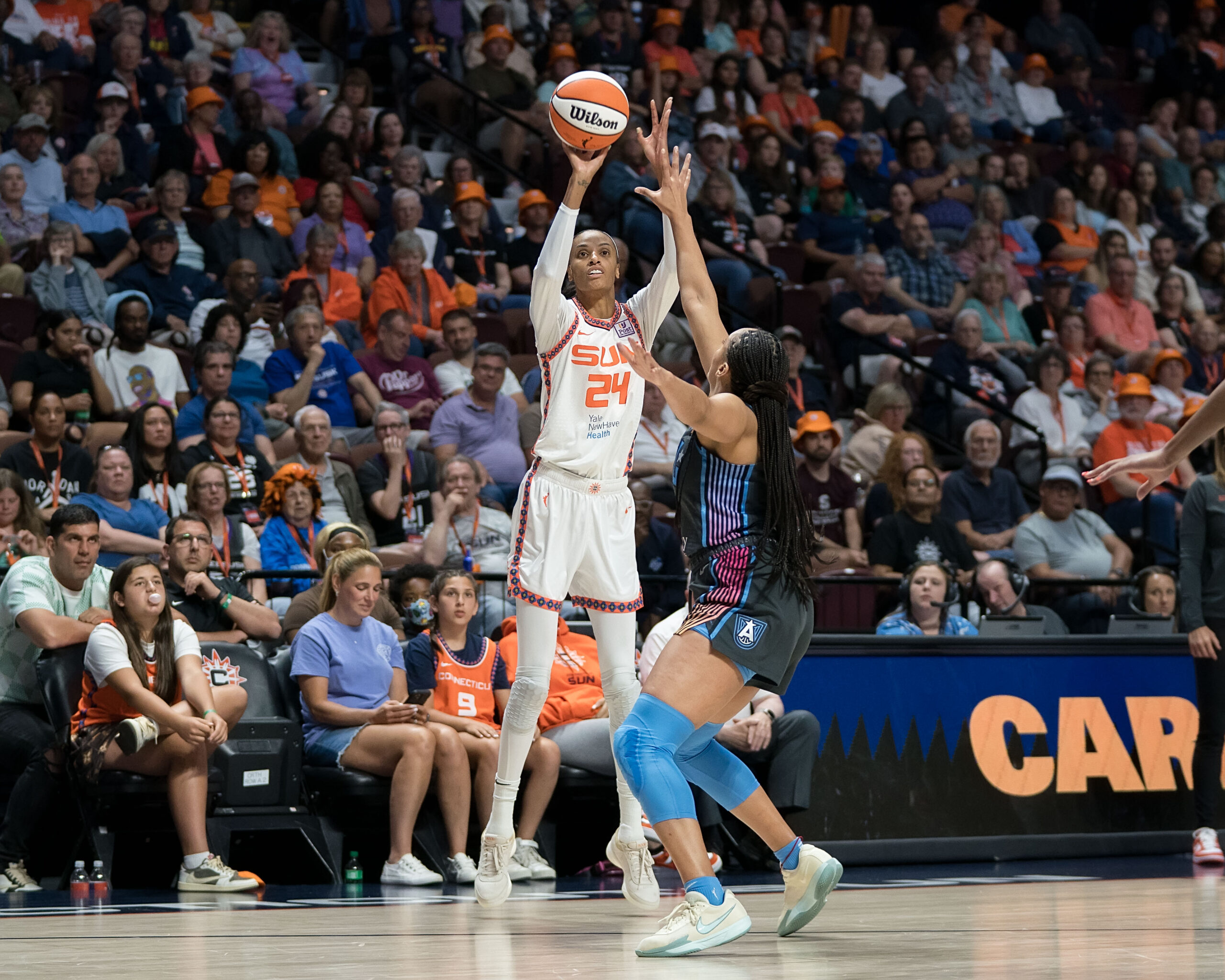 DeWanna Bonner shoots the basketball over a defender