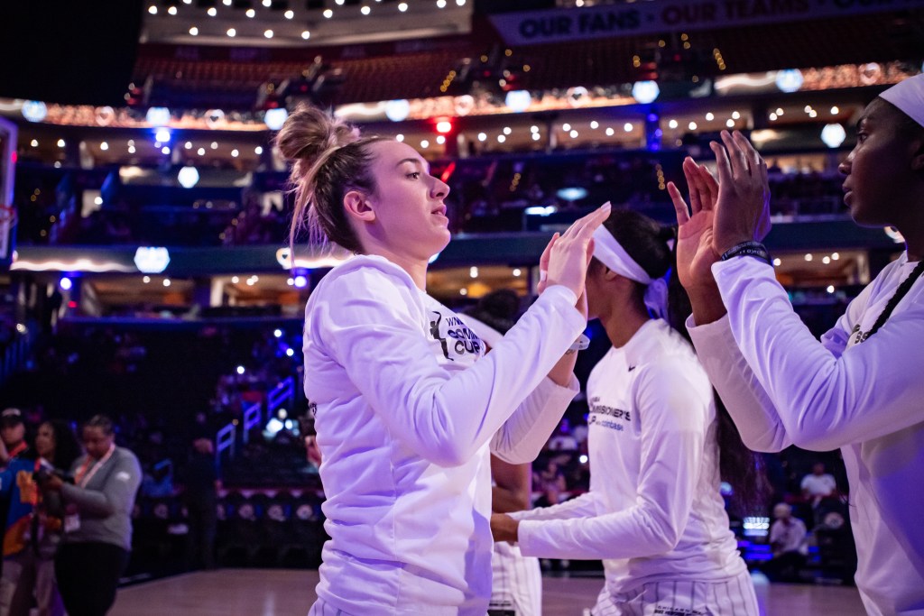 Chicago Sky guard Marina Mabrey high-fives center 